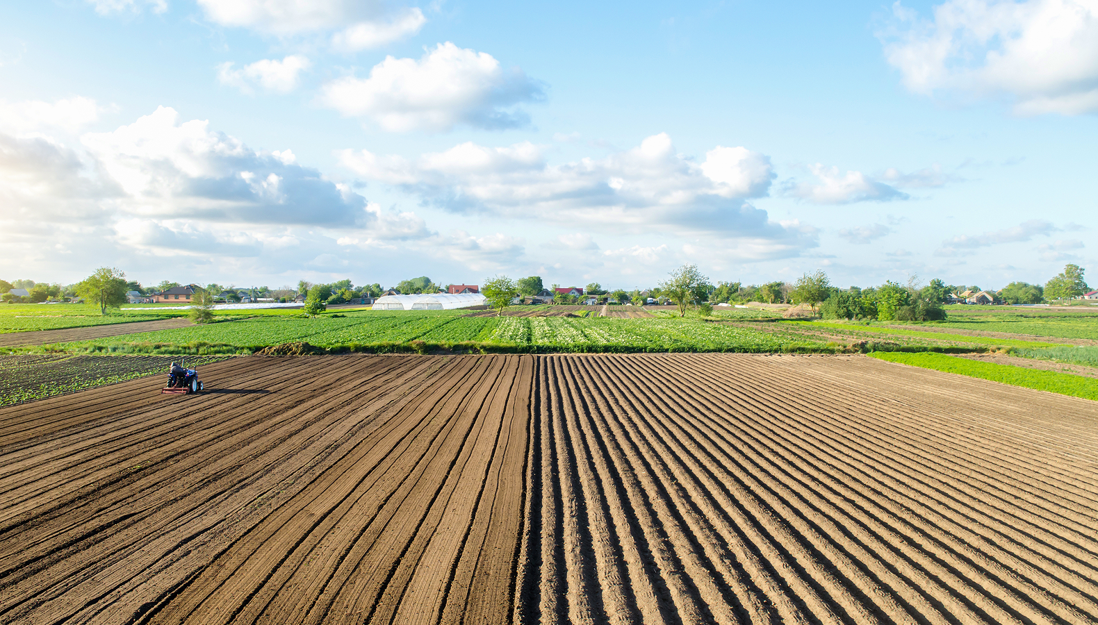 farm-field-landscape-and-a-tractor-agricultural-i-2025-03-18-18-53-59-utc 1